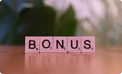 Scrabble tiles spelling the word bonus