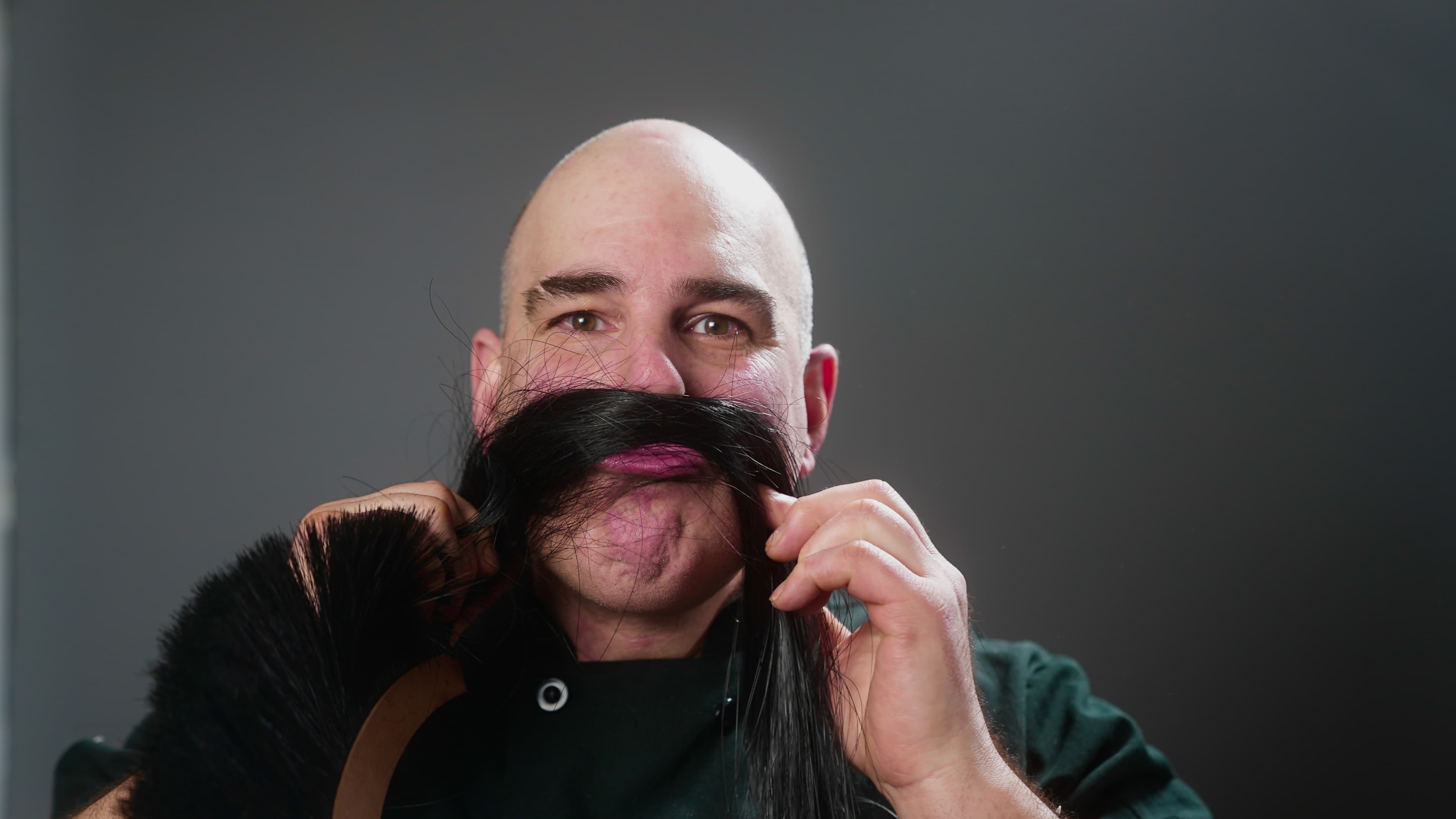 Close-up of a man with a beard and mustache.