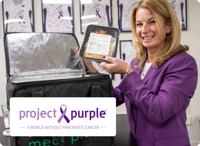 Nutre team member delivering meals for Project Purple